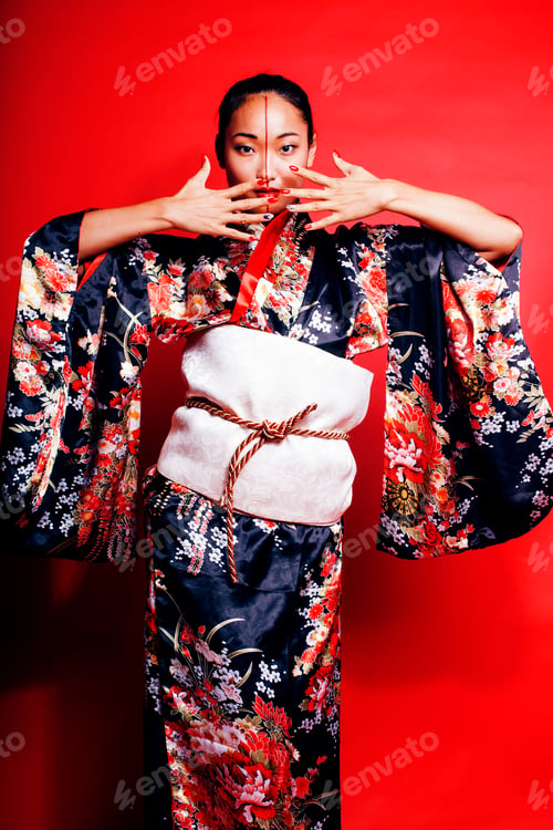 Preview: Young Pretty Geisha On Red Background Posing In Kimono, Oriental