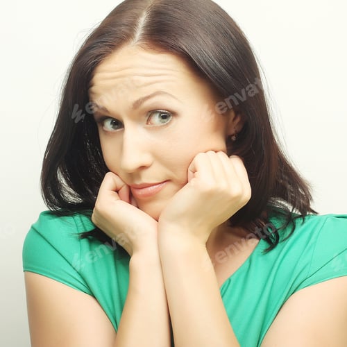 Preview: Thinking Young Woman. Studio Shot.