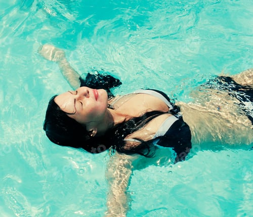 Preview: Portrait Of A Young Woman Smiling In A Swimming Pool