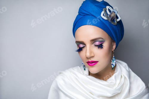 Preview: Young Beautiful Girl Wearing Blue Oriental Scarf Wrapped Around Her Head. Magic Chalma Blue