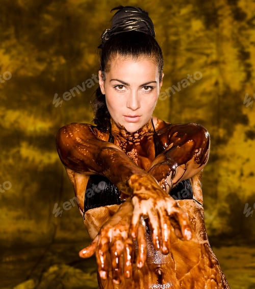 Preview: Young Brunette Girl On Bright Background Covered Chocolate Cream All Over Her Body And Face