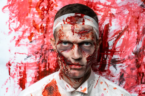 Preview: Crazy Zombie Horror Make Up. Person In White Shirt With Bloody Sweat. Scars, Deep Scratches