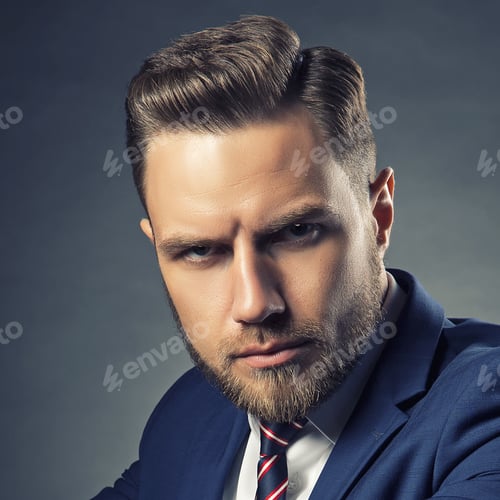 Preview: Young Handsome Bearded Caucasian Man With Blue Eyes Sitting On Chair. Perfect Skin And Hairstyle
