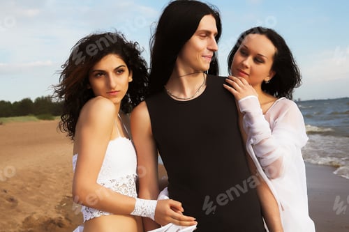 Preview: A Boy And Two Charming Girls During Their Walk On The Seashore