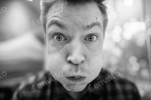 Preview: Face Of Young Handsome Tourist Man Making Funny Face