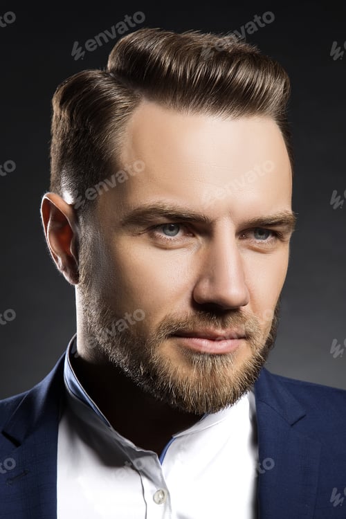 Preview: Young Handsome Bearded Caucasian Man With Blue Eyes Sitting On Chair. Perfect Skin And Hairstyle