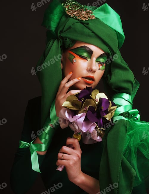 Preview: Young Woman With Creative Make Up Holding A Bouquet Of Jewelry