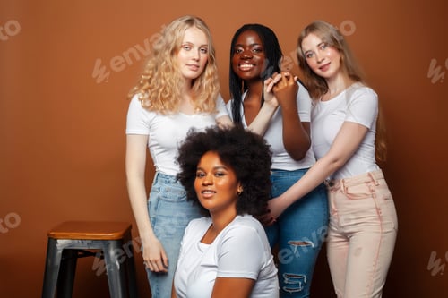 Preview: Young Pretty Caucasian, Afro, Scandinavian Woman Posing Cheerful Together On Brown Background