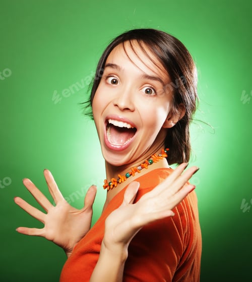 Preview: Young Surprised Woman Over Green Background