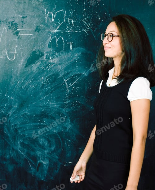 Preview: Portrait Of Happy Cute Student In Classroom At Blackboard Back To School Having Fun
