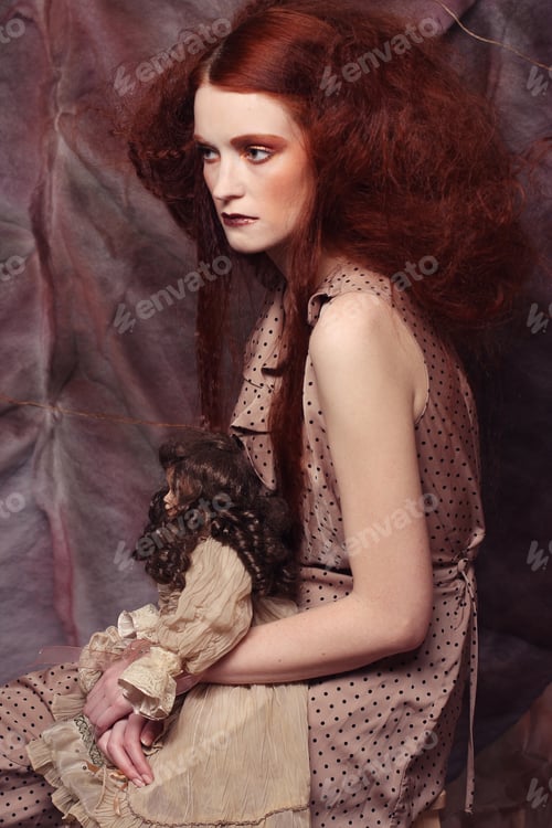 Preview: Lady With Artistic Make-Up With Doll