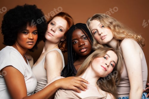 Preview: Young Pretty African And Caucasian Women Posing Cheerful Together On Brown Background, Lifestyle