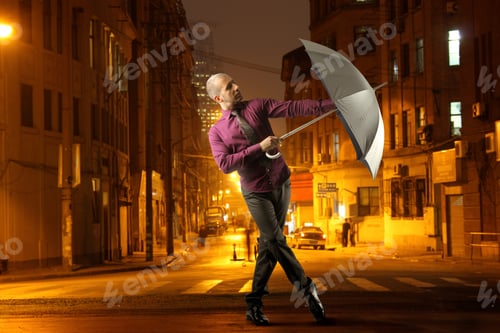 Preview: Man Dancing With Umbrella In A City Street