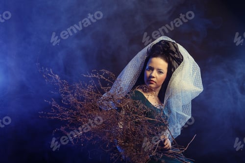 Preview: Girl In Medieval Dress With Bunch Of Sticks In Smoke