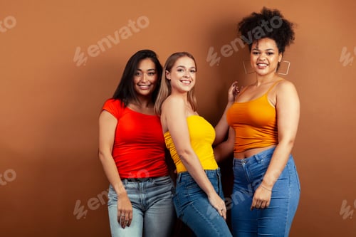 Preview: Young Pretty Multiracial Girls Posing Cheerful On Brown Background, Lifestyle People Concept