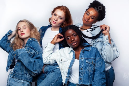 Preview: Four Young Women Wearing Denim Jackets Posing Together