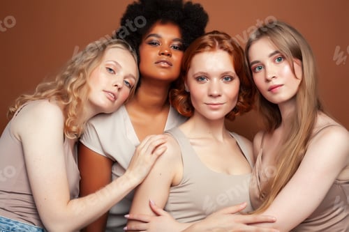 Preview: Young Pretty African And Caucasian Women Posing Cheerful Together On Brown Background, Lifestyle