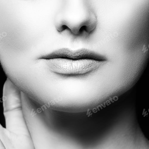 Preview: Beautiful Woman Lips, Beauty Part Of Face With Perfect Skin. Black Background. Black And White
