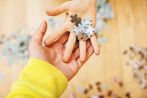 Preview: Little Kid Playing With Puzzles On Wooden Floor Together With Parent, Lifestyle People Concept