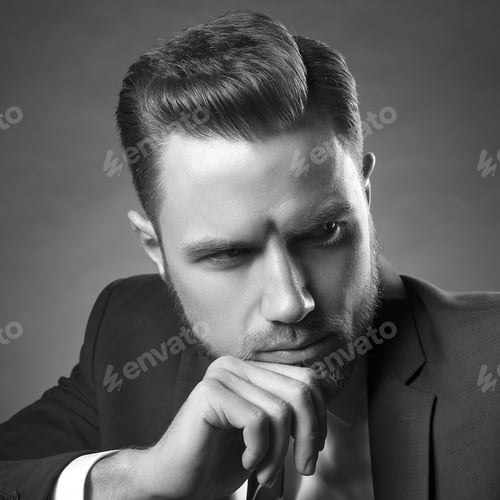 Preview: Young Handsome Bearded Caucasian Man With Blue Eyes Sitting On Chair. Perfect Skin And Hairstyle