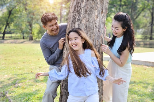 Preview: Happy Family Playing Tag Game Or Catch Up With Daughter In The Park During Summer Season With Big