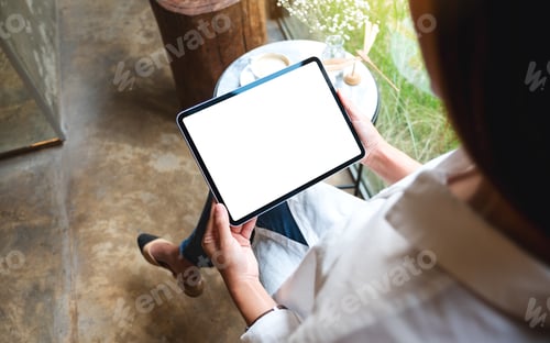 Preview: Mockup Image Of A Woman Holding Digital Tablet With Blank White Desktop Screen In Cafe
