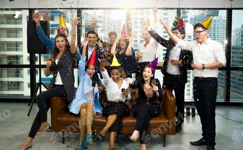 Preview: Group Of Happy Colleagues Having Fun At A New Year Celebration Ahead Or Business Success. Coworkers