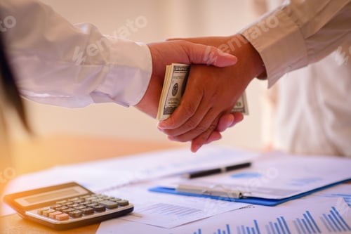 Preview: Cropped Image Of Businessman Bribing Partner While Shaking Hand Outdoors