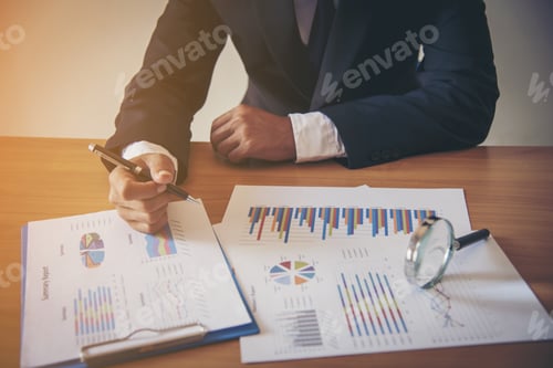 Preview: Adult Analyzing Business Reports with Magnifying Glass