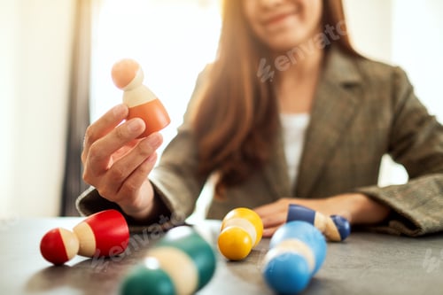 Preview: Businesswoman Leader Choosing Wooden People From A Group Of Employees In Office