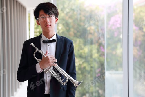 Preview: Young Musician Men Wearing Black Suit And Holding Trumpet