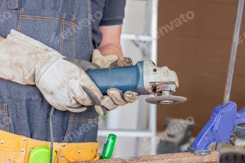Preview: Worker In Workwear Working With Electrical Sander By Manual With Safety Equipment