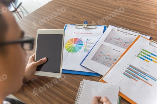 Preview: Office Man Working With Tablet And Financial Report