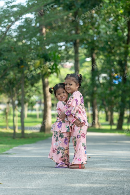 Preview: Malay Muslim Little Girls In Their Beautiful Eid Dress. Outdoor Portrait