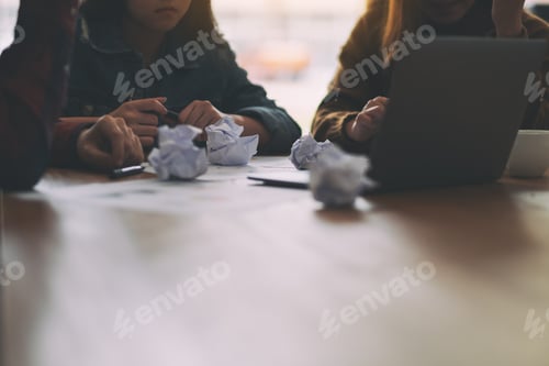 Preview: Closeup Image Of Screwed Up Papers And Laptop On Wooden Table And Businessman In Office