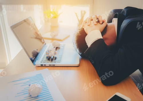 Preview: Stressed Man Working On Laptop