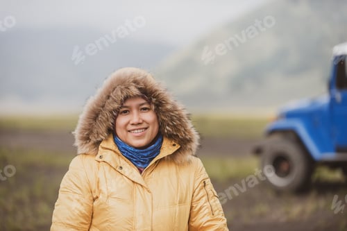 Preview: Smiling Muslim Female Tourist Wearing A Winter Coat.
