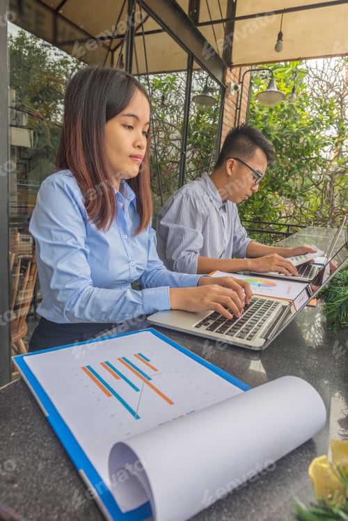 Preview: Side View Of Business Office Employees Working On Laptop