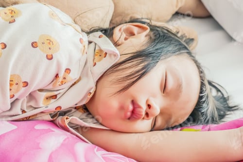 Preview: Sleeping Baby Or Infant Girl On Bed In Bedroom With Teddy Bear In Her Arms.