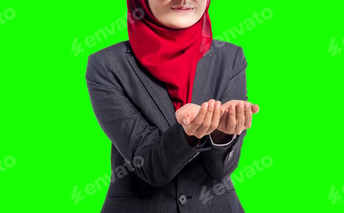 Preview: Muslim Businesswoman Cupping Hands - Act Of Receiving. Isolated On Green