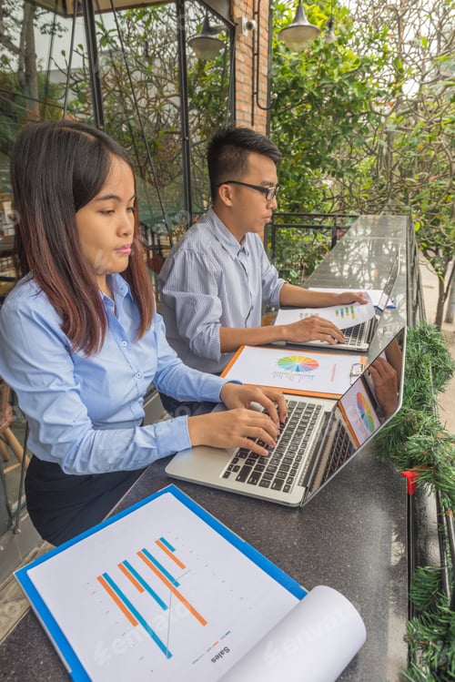 Preview: Vertical Of Office Employees Working On Laptop