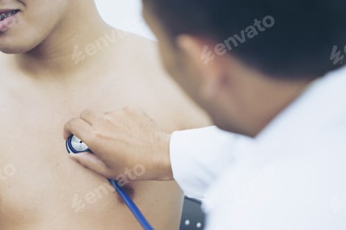 Preview: Close Up Of Doctor Listening To Patient Heartbeat With Stethoscope On Hospital. Concept Of Physical