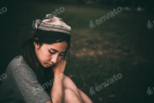 Preview: Lonely Asian Woman Sit Alone In The Park,Sad Thai Woman Think Something,Heartbreak Girl Concept