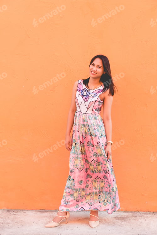 Preview: Portrait Of Beautiful Asian Woman Pose On Orange Wall,Lifestyle Of Single Girl