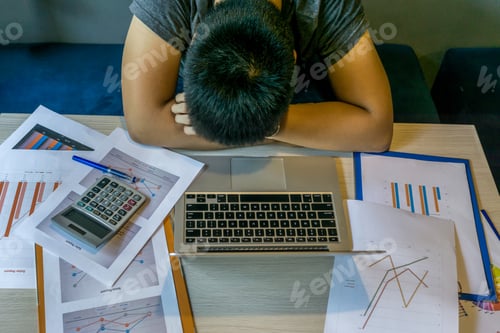 Preview: Exhausted Millennial Fall Asleep On Desk With Laptop, Unorganized Document