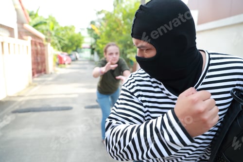 Preview: Thief Stealing Money From Woman And Running On Street (Theft Concept)