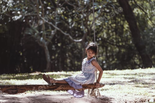 Preview: The Lonely Girl Sitting On A Swing At The Park.