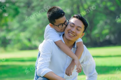 Preview: Boy Kiss To His Dad In The Park.Happy Family In The Park