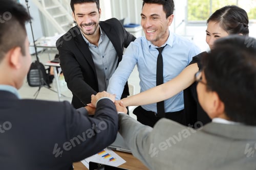 Preview: Close Up Of Multiethnic Business People Stacking Hands Together Meaning Of Teamwork Concept