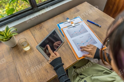 Preview: High Angle View Of Woman Using Tablet, Analyzing Diagram Document